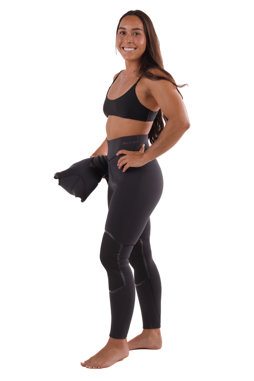 Woman smiling in a studio wearing Waihana Women&